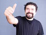 Happy man giving thumbs-up sign.
