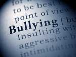 Word bullying on page of dictionary.